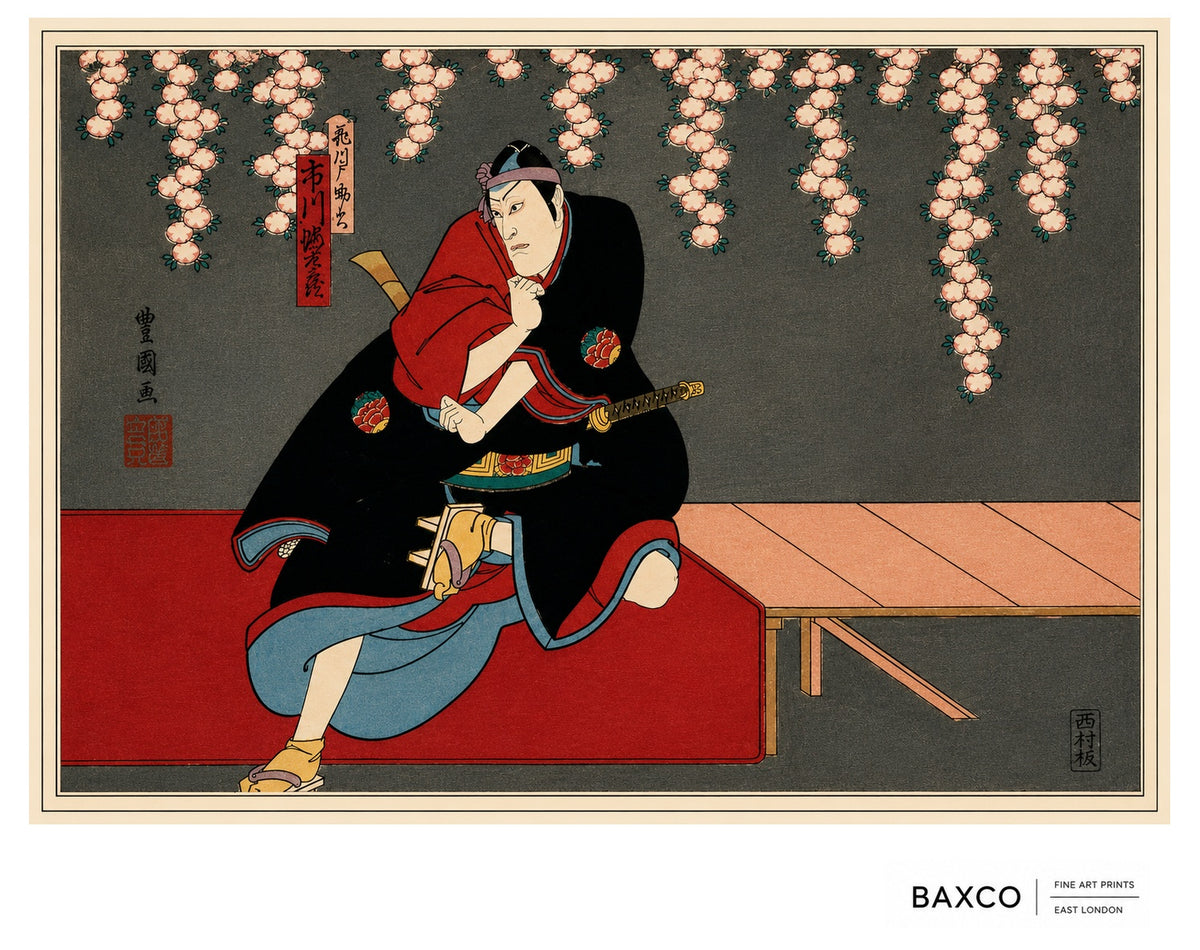 Shōbu takes its name from the Japanese word for a contest or showdown, capturing the tension at the heart of this theatrical scene.

This reproduction of an early 1860s colour woodcut by Utagawa Kunikazu depicts a kabuki actor crouched beneath cascading cherry blossom, his sword held at his side. Bold expanses of black, vermilion, and muted blue contrast with the delicacy of the flowers overhead, giving the composition a powerful sense of anticipation.